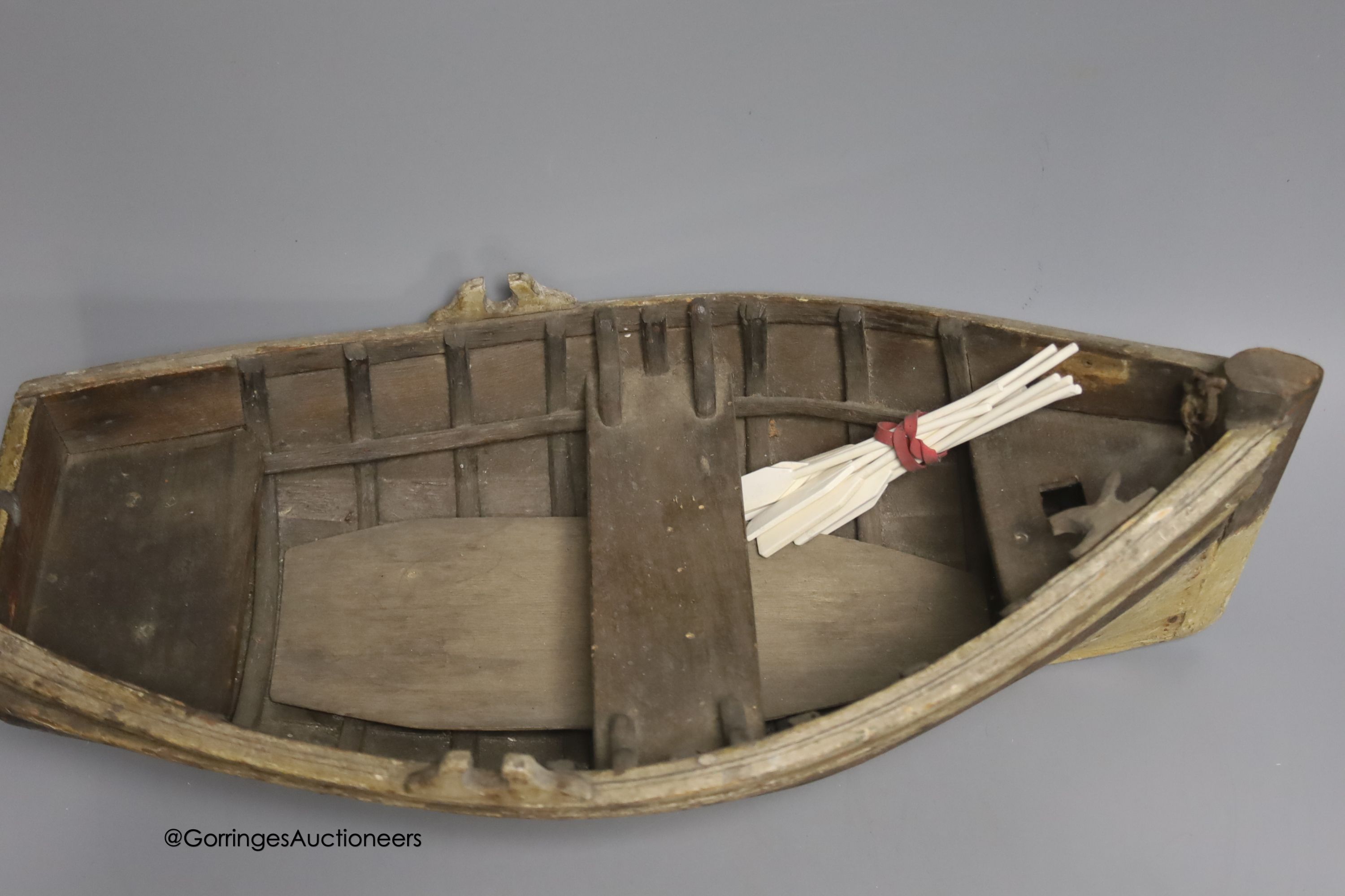 A clinker-built wood rowing boat, 41cm, and four smaller boat models